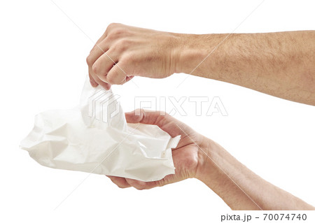 Man cleaning his hand with wet tissue isolated on white background 70074740