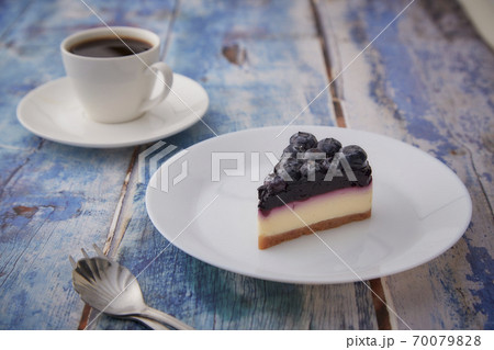 Cheesecake blueberry on wooden table 70079828