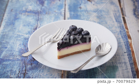 Cheesecake blueberry on wooden table 70079829