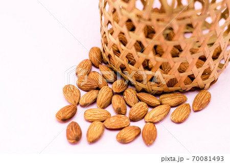 Almonds in round bamboo basket Almonds in round bamboo basket 70081493