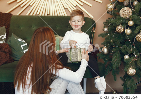 Mother with cute son near christmas tree 70082554