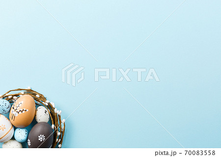 Easter background with painted eggs on blue  70083558