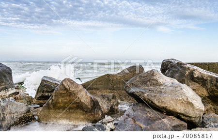 seascape with rocks and surf in the foreground seascape with rocks and surf in the foreground 70085817