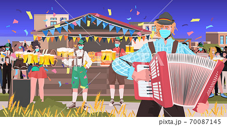 musician playing accordion mix race people having fun octoberfest party celebration open air outdoor festival musician playing accordion mix race people having fun octoberfest party celebration open air outdoor festival 70087145