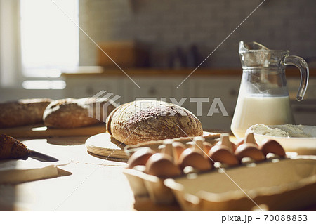 Bakery baker bread. Fresh homemade bread on a table in the kitchen. 70088863