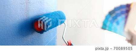 Blue protective glove on hand Blue protective glove on hand 70089505