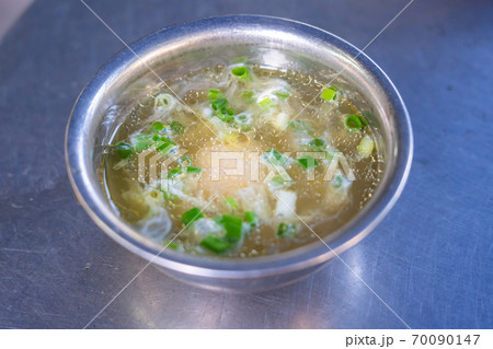 Bowl of Pho broth soup served with chicken egg Bowl of Pho broth soup served with chicken egg 70090147