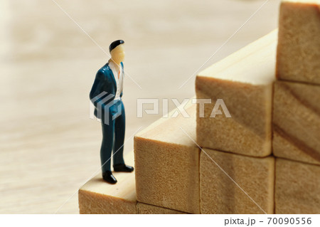 The concept of the career ladder at the beginning of the way employee The concept of the career ladder at the beginning of the way employee 70090556