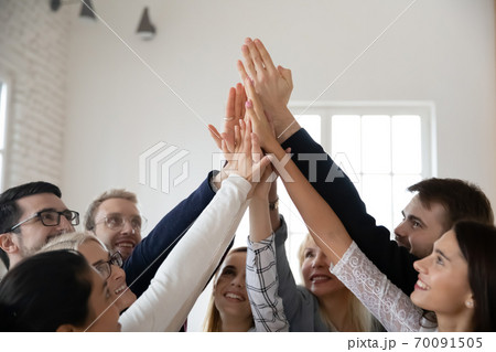 Excited diverse businesspeople give high five participate in teambuilding 70091505