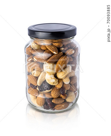 Clear glass bottle with mixed nuts healthy organic food isolated on white background 70093885