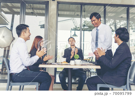 Group of business people meeting in conference room brainstorming consult business document graph 70095799