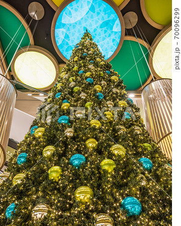 beautiful green Christmas tree colorful Hanging decoration balls closeup beautiful green Christmas tree colorful Hanging decoration balls closeup 70096299