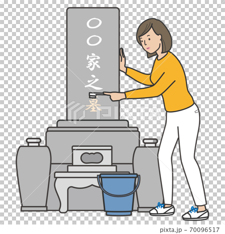 一個女人用刷子清洗墓碑 70096517