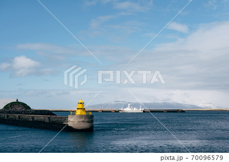 A large yellow lighthouse in Iceland, Reykjavik. 70096579