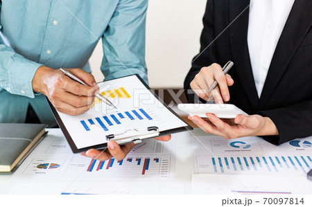 Meeting a team of businessmen, Executives and accountants meeting about the company's revenue graph in the office with laptops and calculators, Finance concept. 70097814