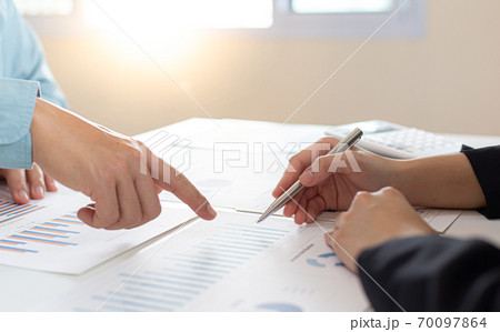 Meeting a team of businessmen, Executives and accountants meeting about the company's revenue graph in the office with laptops and calculators, Finance concept. 70097864