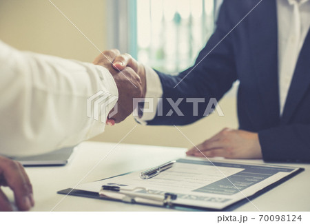 Employer or HR department welcomes new employees, Shaking hands with congratulations or achieving business and income success, Hand shak concept. 70098124