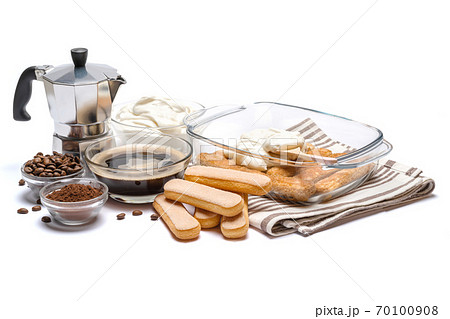 tiramisu dessert cooking - Traditional Italian Savoiardi ladyfingers Biscuits and cream in glass baking dish isolated on white with clipping path 70100908