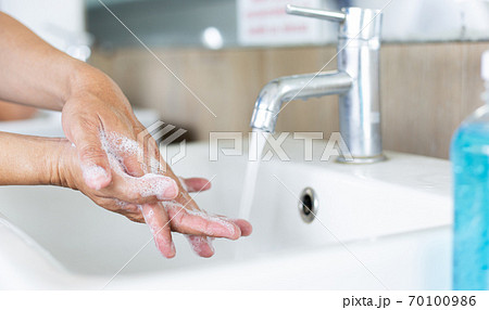 Men are washing their hands in the sinks to clear respiratory bacteria and viruses, sanitation and reduce the spread of COVID-19 that is spread around the world, Hygiene ,Sanitation concept. Men are washing their hands in the sinks to clear respiratory bacteria and viruses, sanitation and reduce the spread of COVID-19 that is spread around the world, Hygiene ,Sanitation concept. 70100986