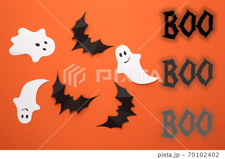 Halloween composition of black bats, white ghost on yellow background. Home handmade decor 70102402