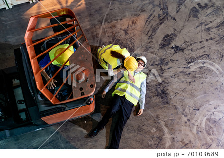 Warehouse worker call ambulance after accident top view 70103689