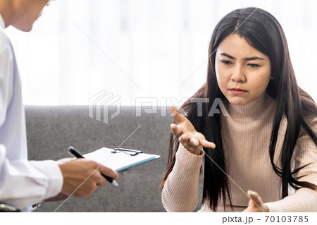 Portrait asian woman patient talking with mental health problem 70103785