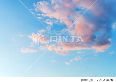 Vanilla sky. Azure sunset sky with light pink clouds. Vanilla sky. Azure sunset sky with light pink clouds. 70103876