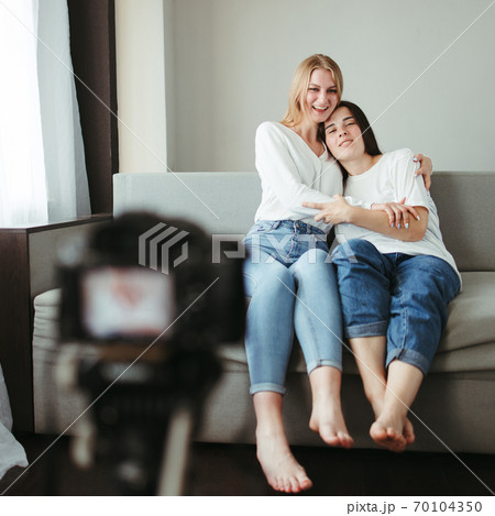 Two female bloggers streaming online video 70104350