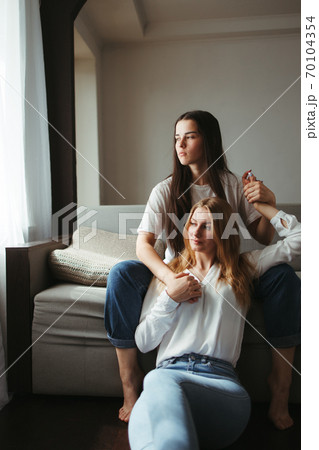 Girlfriends in love sharing time together indoors 70104354