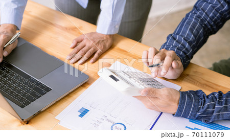 Business Corporate meeting using laptop at conference table discussing ideas for their business project in modern office. 70111079