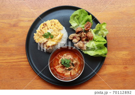 Breakfast in the round plate on the wooden floor. Breakfast in the round plate on the wooden floor. 70112892