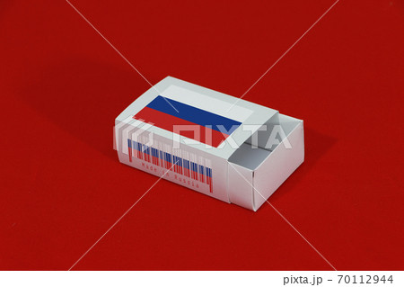Russia flag on white box with barcode and the color of nation flag on red background Russia flag on white box with barcode and the color of nation flag on red background 70112944
