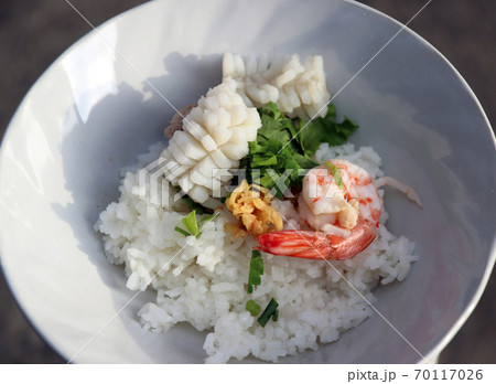 rice mixed with Shrimp, squid and pork, Garnish with coriander and preserved of Celery. 70117026