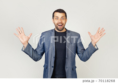 Young businessman man with a beard in a jacket, celebrating crazy and amazed with success with Young businessman man with a beard in a jacket, celebrating crazy and amazed with success with 70118268
