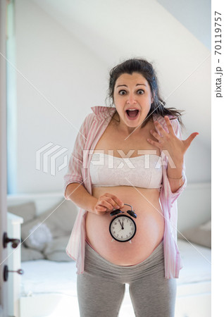 Portrait of happy pregnant woman indoors at home, due date concept. 70119757