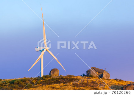 Windmill power generator and famous stone house - Guimaraes Portugal Windmill power generator and famous stone house - Guimaraes Portugal 70120266