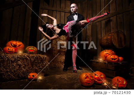 Vampires with Halloween pumpkins 70121430