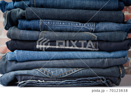 a pile of folded blue jeans different a pile of folded blue jeans different 70123638