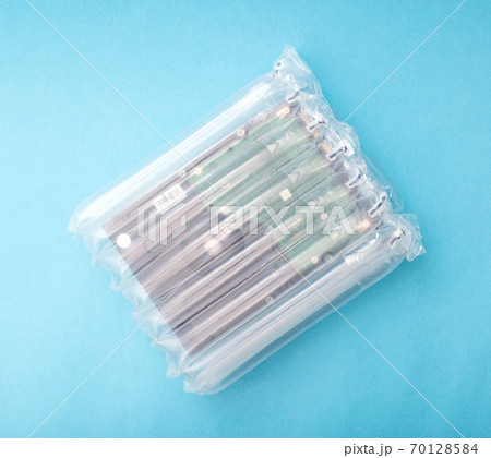 protective packaging made of polymers used for sending goods by mail. The concept of the integrity and safety of goods from shocks and damage during transportation, polyethylene protective packaging made of polymers used for sending goods by mail. The concept of the integrity and safety of goods from shocks and damage during transportation, polyethylene 70128584