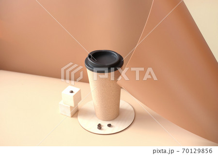 trendy coffee mug on a beige backgroung.  70129856