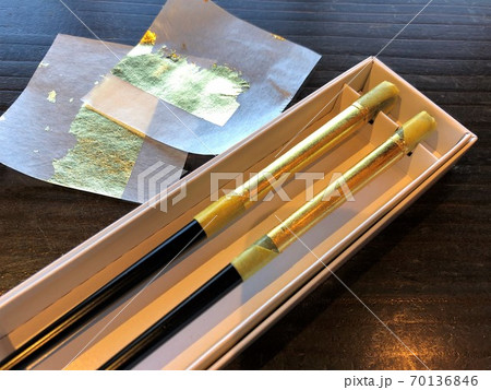 Gilding chopsticks with gold leaf. A fun workshop in KANAZAWA, JAPAN. Gilding chopsticks with gold leaf. A fun workshop in KANAZAWA, JAPAN. 70136846