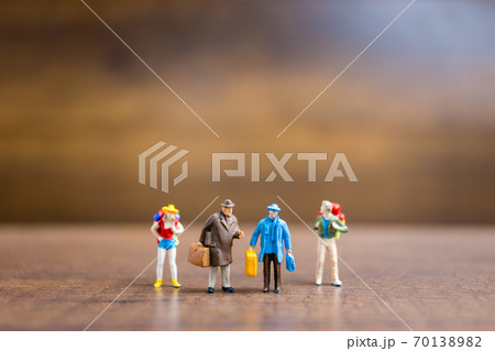 Miniature people travelers standing on wooden background , Travel concept 70138982