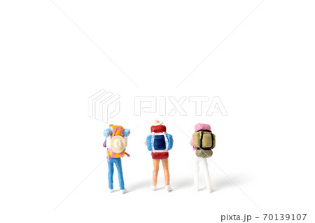 Miniature Backpacker isolated on white background Miniature Backpacker isolated on white background 70139107