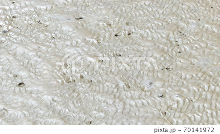 Puddle and mud texture, abstract background Puddle and mud texture, abstract background 70141972