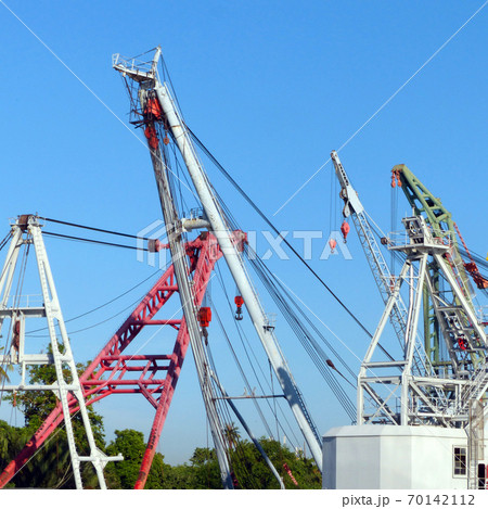 many cranes are waiting for cargo in harbour many cranes are waiting for cargo in harbour 70142112