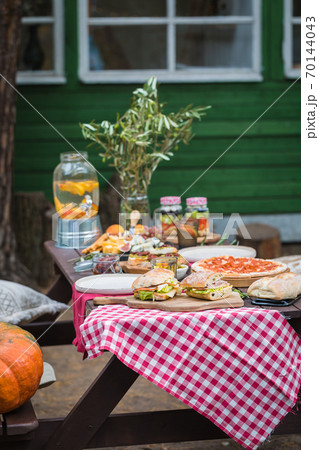 Assorted Italian food table setting in the garden, selective focus Assorted Italian food table setting in the garden, selective focus 70144043
