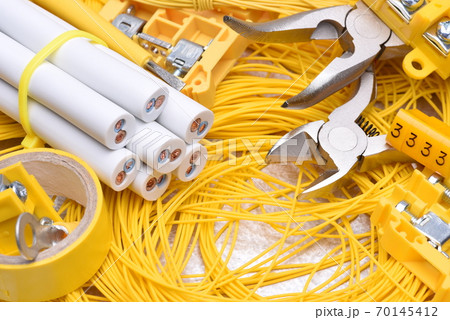Tools and cables used in electrical home installation, closeup Tools and cables used in electrical home installation, closeup 70145412