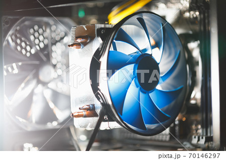blue cpu cooler inside PC case, shiny light background blue cpu cooler inside PC case, shiny light background 70146297