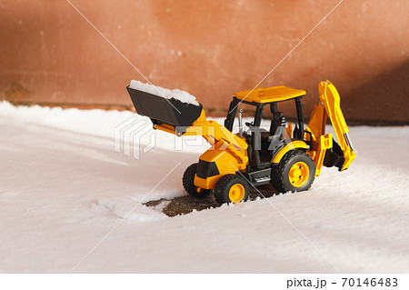 tractor toy removes snow out of the way tractor toy removes snow out of the way 70146483