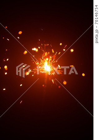 Christmas sparkler in haze with red light 70146754